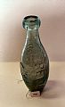 Glass bottle - Green glass bottle with Church Stretton Co. Limited emb…